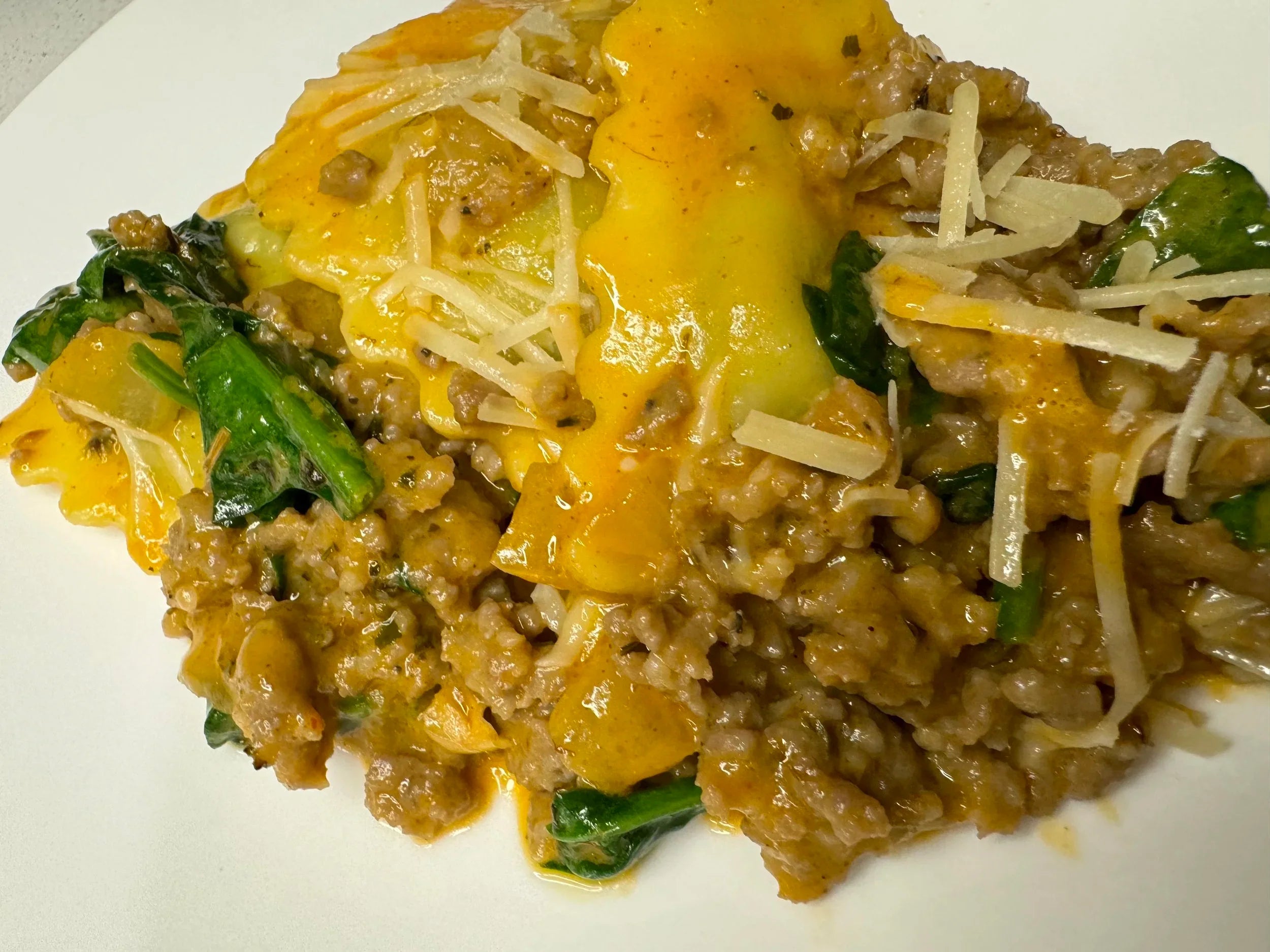 Spinach Ricotta Ravioli with Italian Sausage and Roasted Red Pepper Sauce