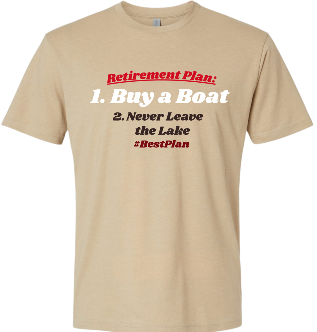 A beige crewneck t-shirt with a graphic text print on the chest that reads 'Retirement Plan: 1. Buy a Boat 2.