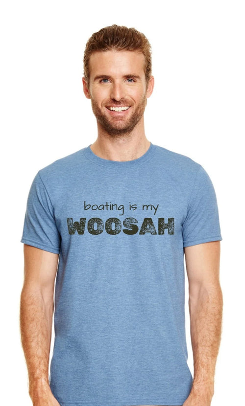 A smiling man with short brown hair and a beard wearing a heather blue t-shirt with the text 'boating is my WOOSAH' printed on the chest, set against a plain white background.