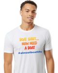 A man wearing a white crewneck t-shirt with the text 'BOAT SHIRT.