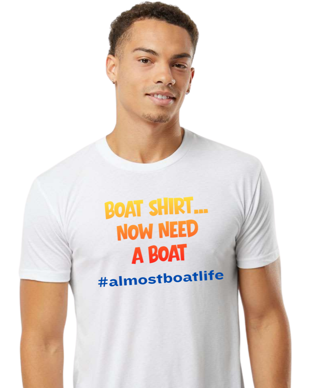 A man wearing a white crewneck t-shirt with the text 'BOAT SHIRT.