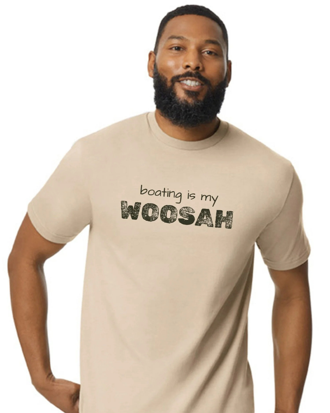 A man wearing a beige crewneck t-shirt with the text 'boating is my WOOSAH' printed on the chest, shown against a plain white background.