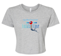 A light heather gray short-sleeve crop top t-shirt with a graphic on the front that reads 'sip, float, repeat' and 'lake Lanier Cocktail Cove' in blue and red text with a pin illustration showing where the cove is.