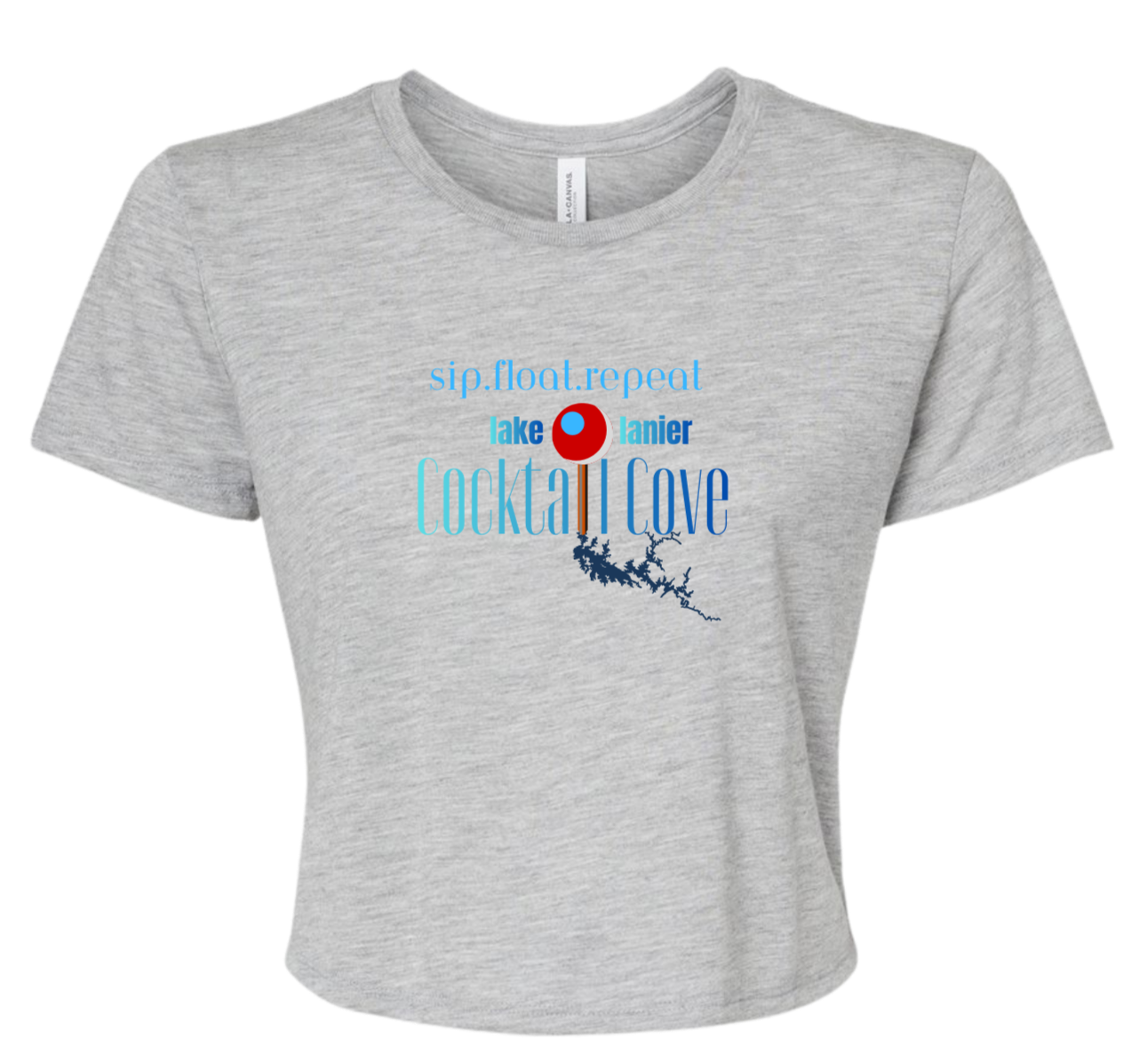 A light heather gray short-sleeve crop top t-shirt with a graphic on the front that reads 'sip, float, repeat' and 'lake Lanier Cocktail Cove' in blue and red text with a pin illustration showing where the cove is.