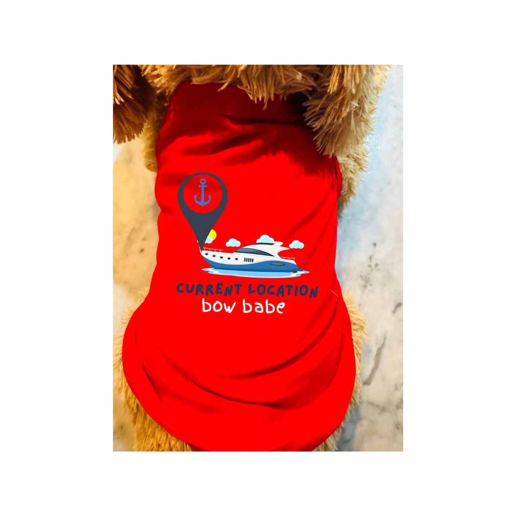 A red dog shirt with a graphic of a boat under a location pin and the text 'CURRENT LOCATION bow babe', shown on a dog.