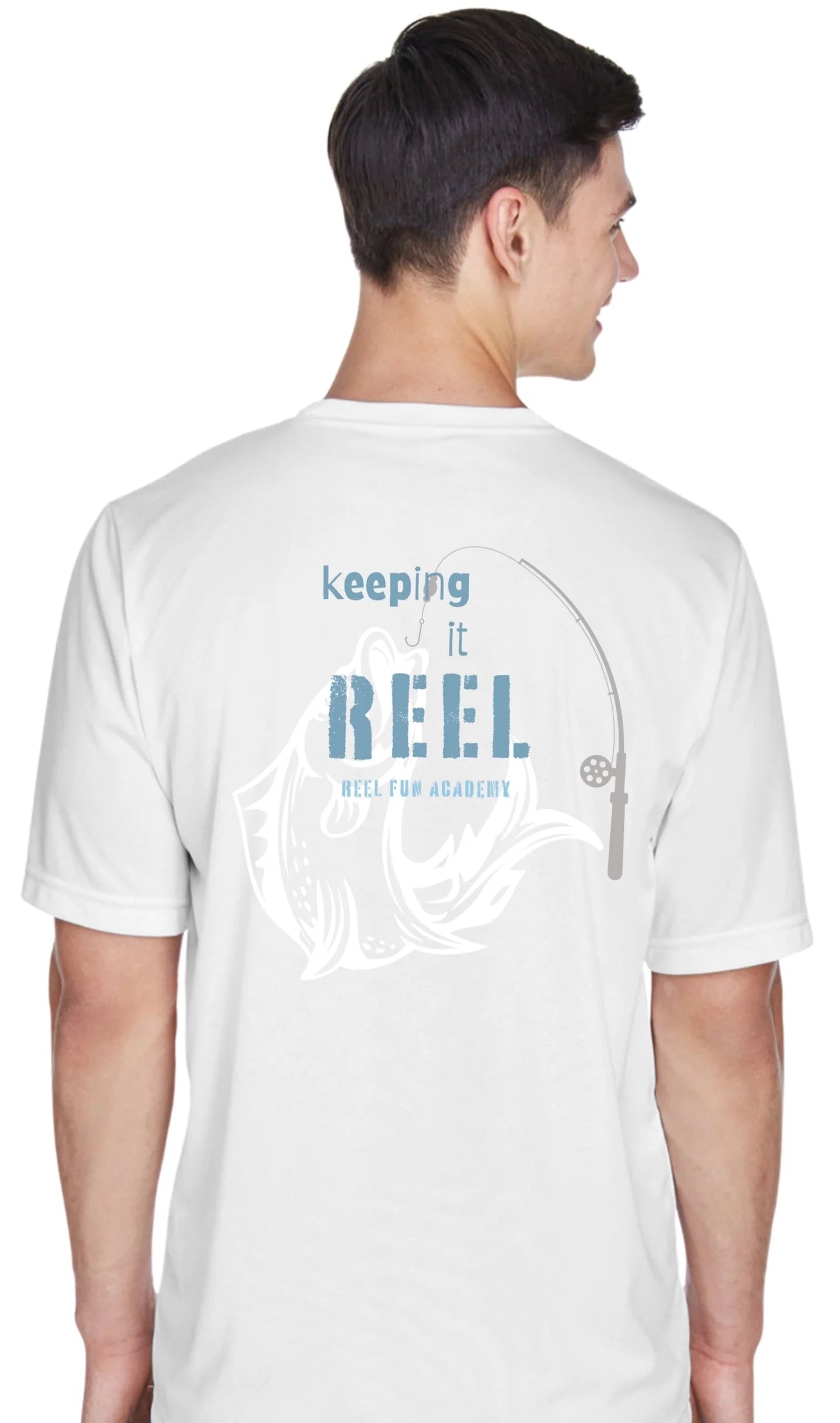 A man shown from the back wearing a white t-shirt with a blue and gray graphic that reads 'keeping it REEL. REEL FUN ACADEMY' with a fishing rod and fish design.