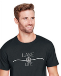 A smiling man with short brown hair and a beard wearing a dark charcoal gray crewneck t-shirt with a white graphic that reads 'LAKE LIFE' and an anchor symbol, set against a plain white background.