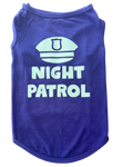 A purple sleeveless pet shirt with a glow in the dark graphic of a police badge and the words 'NIGHT PATROL' printed on the front, shown against a plain white background.