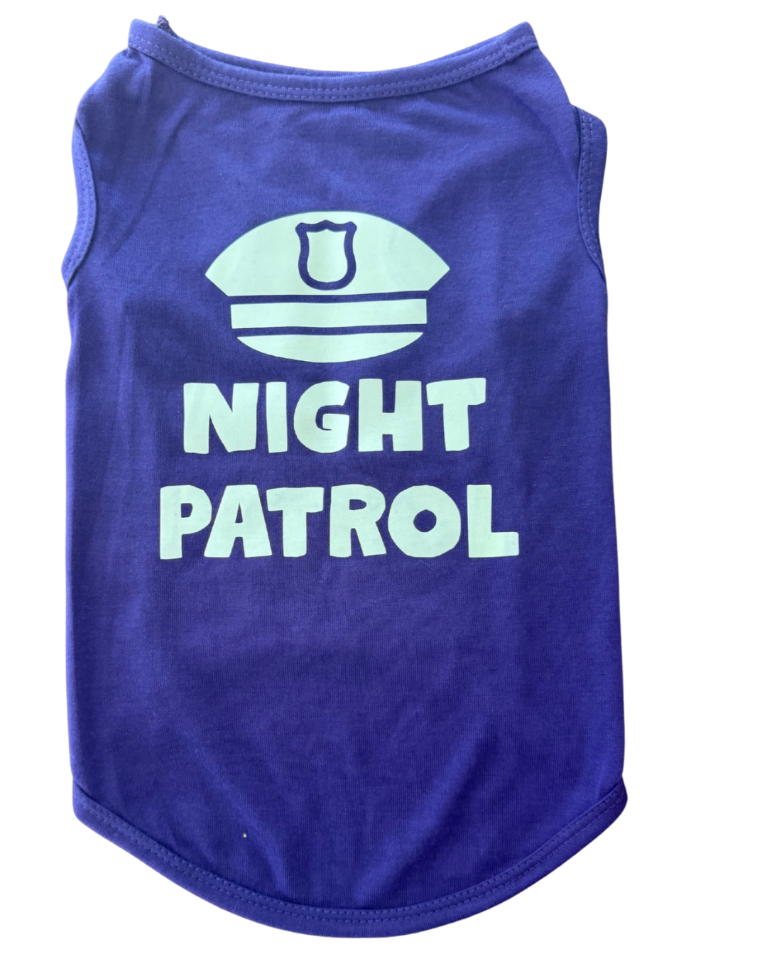 A purple sleeveless pet shirt with a glow in the dark graphic of a police badge and the words 'NIGHT PATROL' printed on the front, shown against a plain white background.