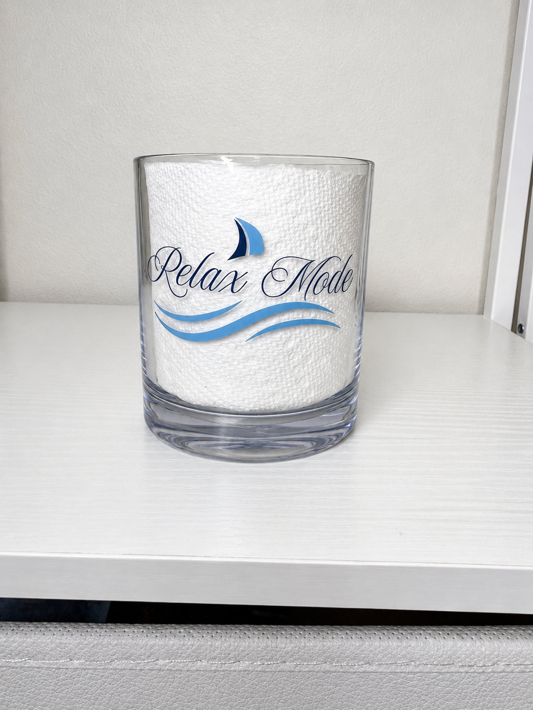 Lowball shatterproof glass with the wording Relax Mode and graphic of wave and sail