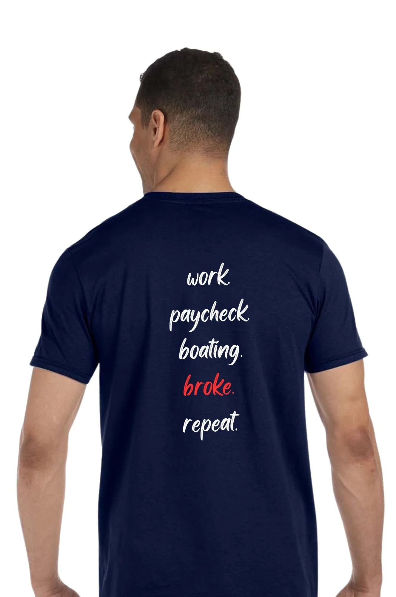 A man viewed from the back wearing a navy blue t-shirt with the text 'work paycheck boating. broke repeat' printed on the back in white and red.