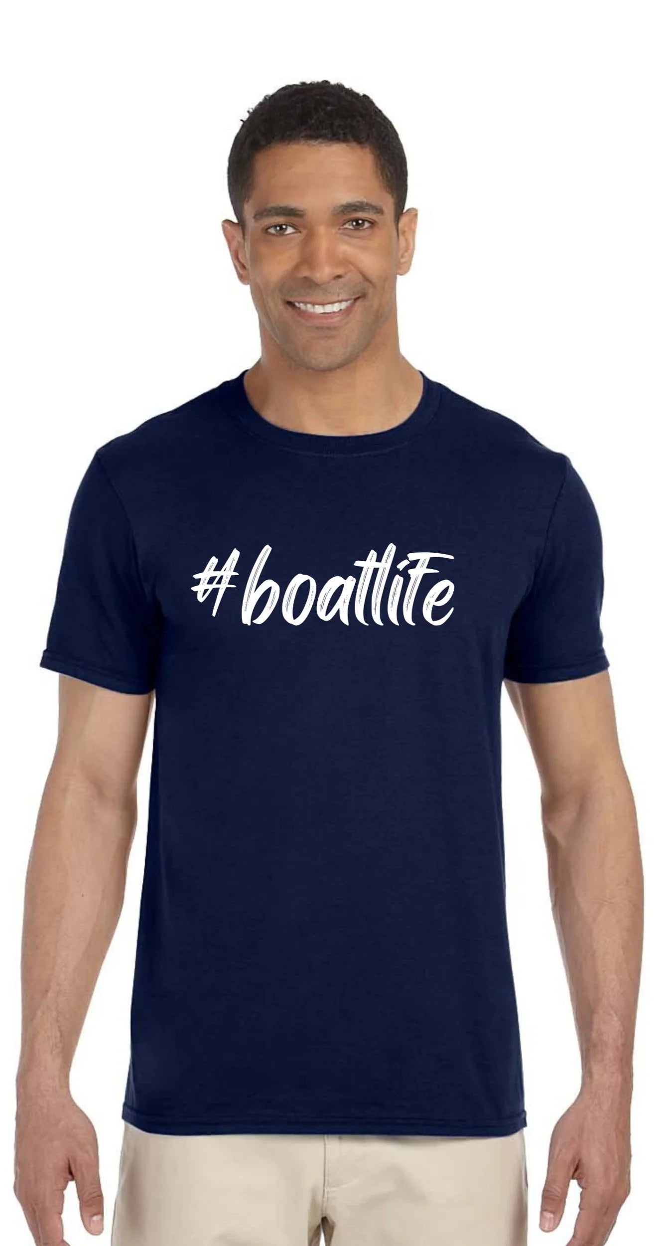 A man wearing a navy blue crewneck t-shirt with the white text '#boatlite' printed across the chest, paired with light beige pants, against a plain white background.