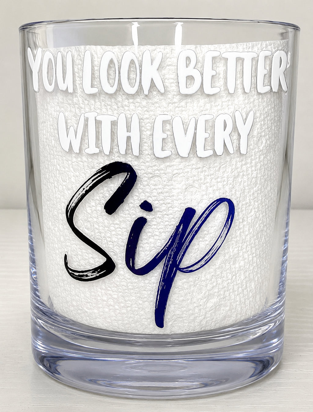 Lowball glass with wording "YOU LOOK BETTER WITH EVERY SIP"