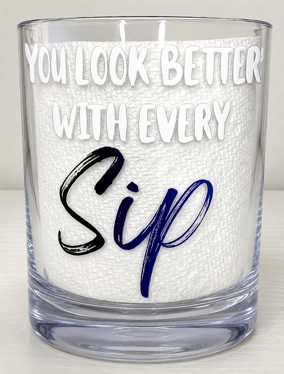 Lowball glass with wording "YOU LOOK BETTER WITH EVERY SIP"